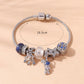 Rhinestone Star & Astronaut Charm Bracelet